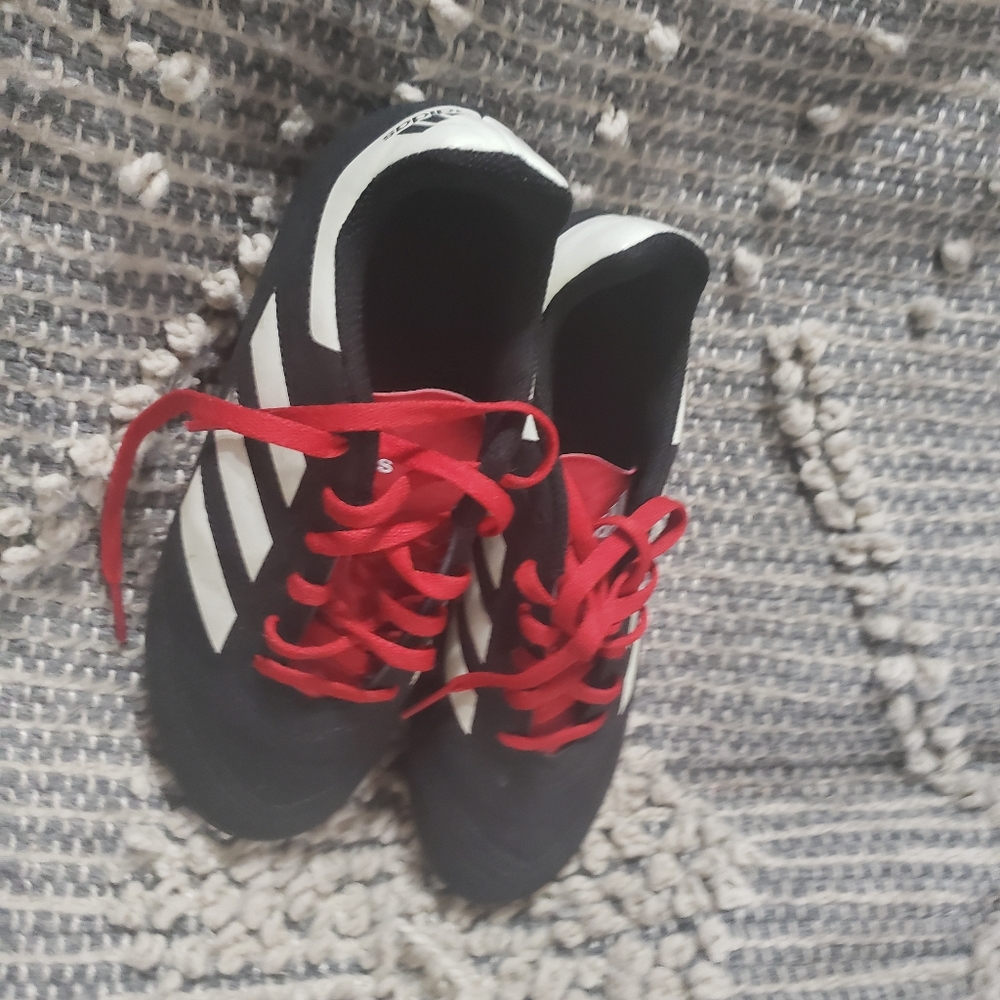 Black red and white cleats